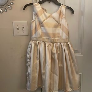 This is a pretty gold and white glittery dress for the little ones. Size 10